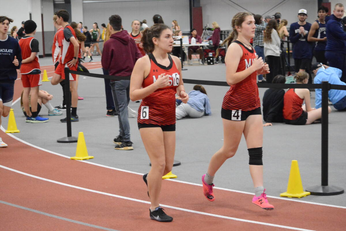 Ashley Colberg and Erin Davis race for Masuk this season. Both runners competed in the conference championships.