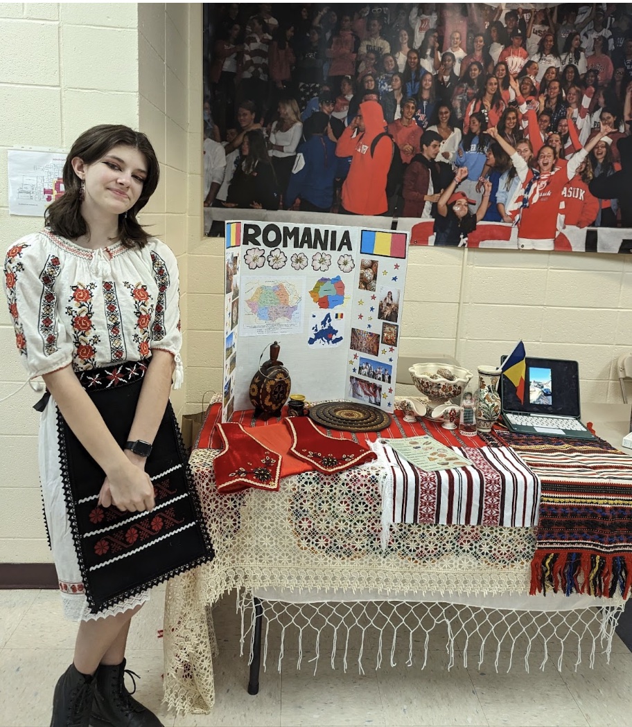 Audrey Booth proudly displays her digital photo album from Romania.