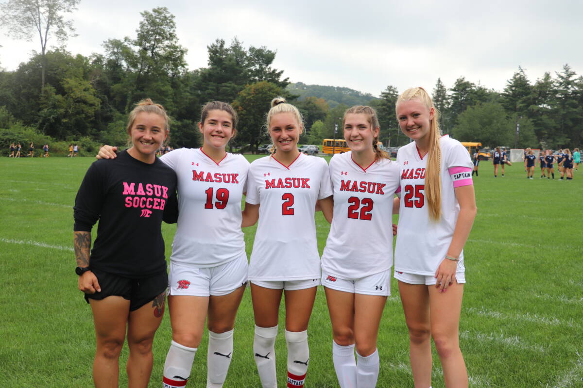 Head Coach Kate Pellegrino with captains, from left, Marise Klutch, Gianna Convertito, Erin Davis and Hannah Dorney.