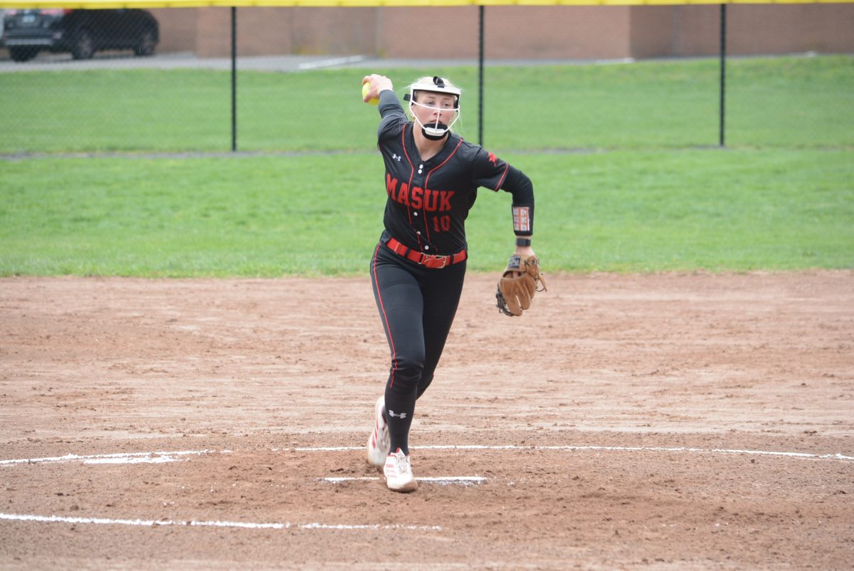 Grace Ely delivers a pitch against Kolbe on April 22.