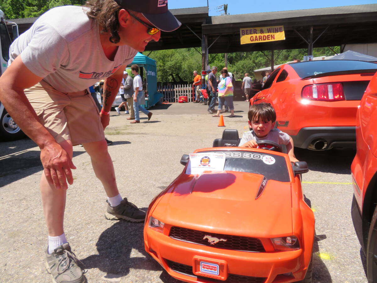 Keith Romano with his son at the Barnum Car Show two years ago.