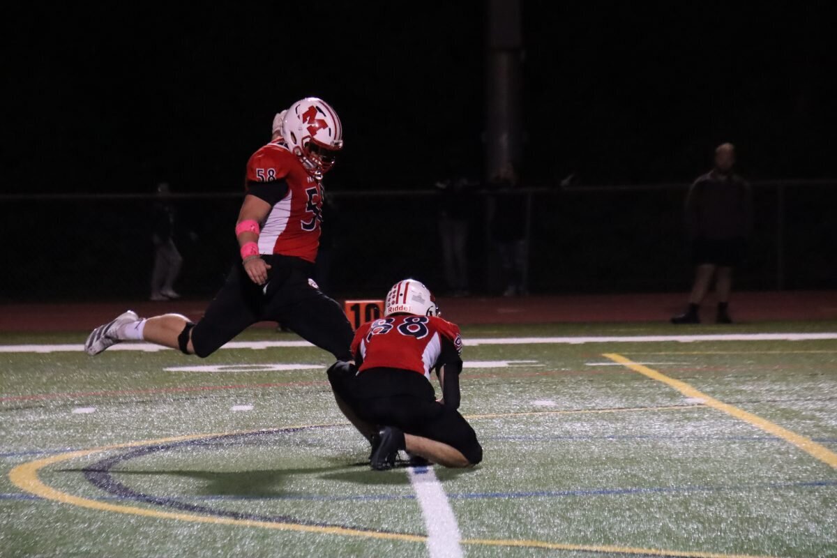 David Skripek kicks the extra point, with help from holder Ricardo Teixeira.