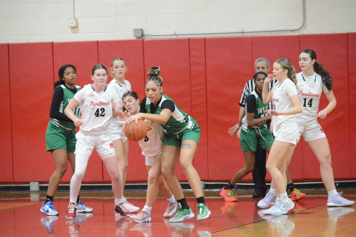 Emma Troesser steals the ball as Peyton Webb (No. 42), Bailey Bajda, Grace Sheppard and Maddie Farrer defend.