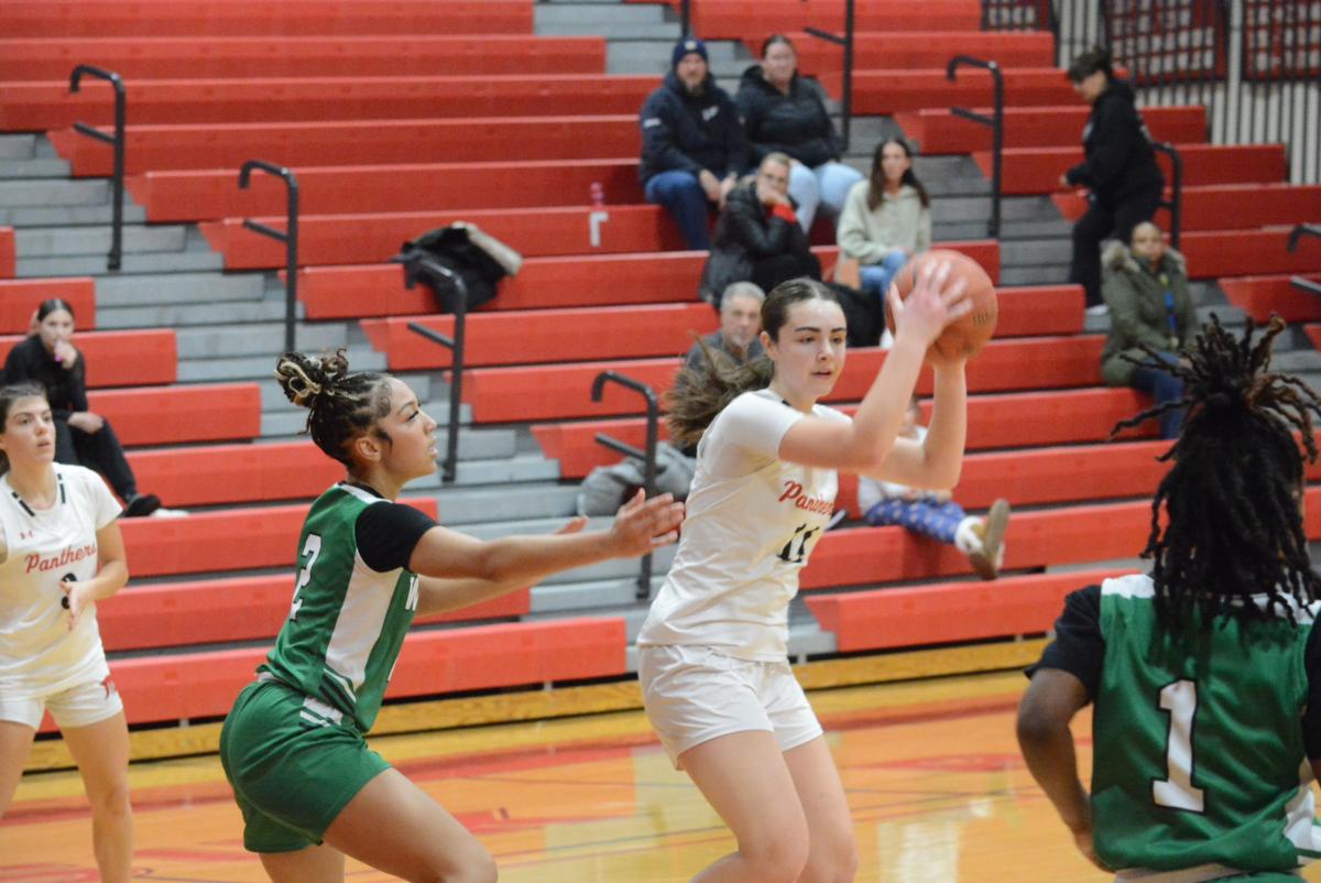 Maddie Farrer looks to make a pass.