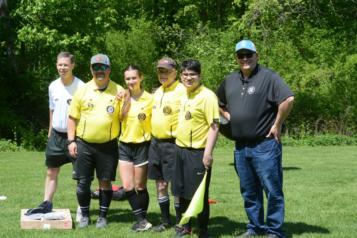 Coaching and Equipment Manager Brendan Sheehan, Referee Assigner James Crawford, referee Evelyn Crawford, Referee Administrator Stan Tait, Yash Raj Verma and Commissioner Ryan Healey.