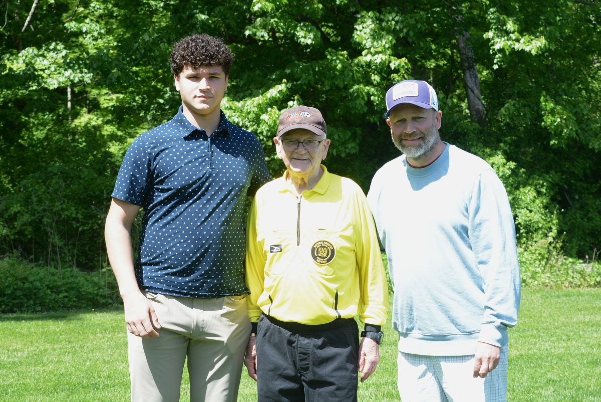 Stan Tait flanked by grandson Brayden and son Shawn.